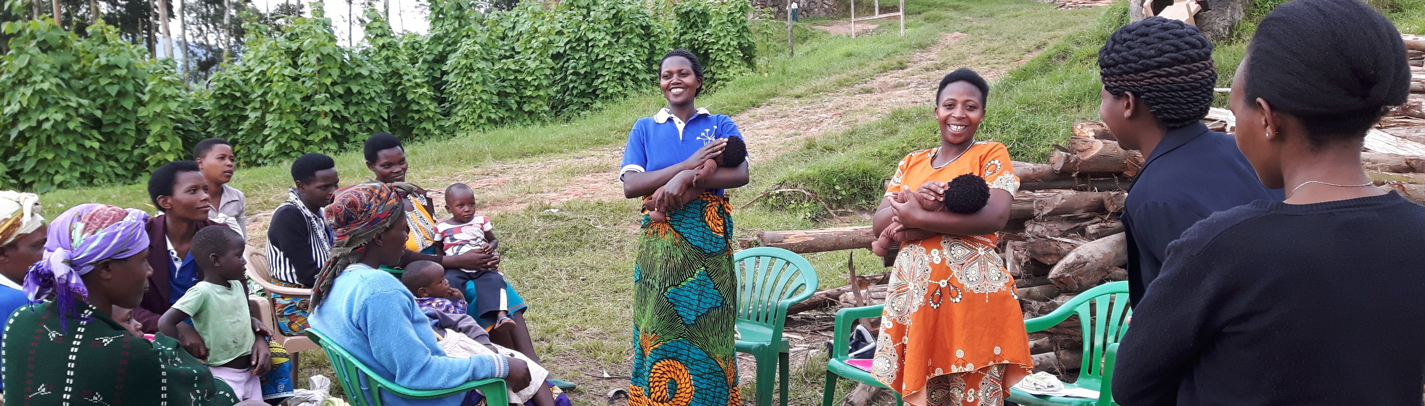 Ugandan ladies receiving Lullaby Africa teaching in open air