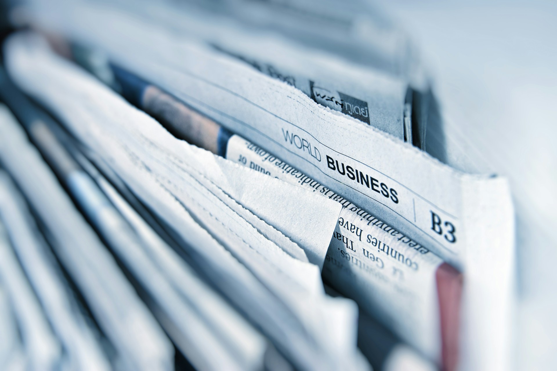 file of newspapers showing a news story