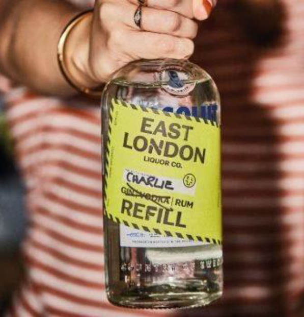 reusable glass bottle with yellow label